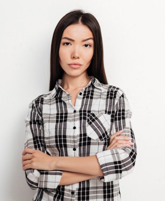 beautiful-girl-with-dark-hair-standing-and-angrily-WV4D4DW.jpg